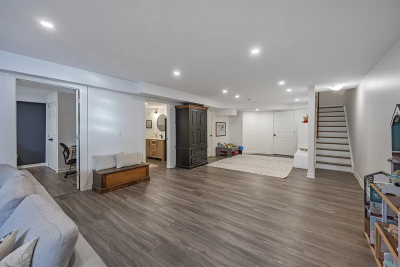 Finished basement with feature wall